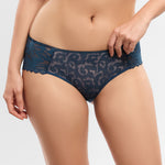 blue lace underwear worn by a person on a white background
