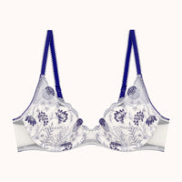 white bra with blue floral patterns and blue straps on a white background