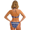 woman wearing a blue and white patterned bikini on a white background