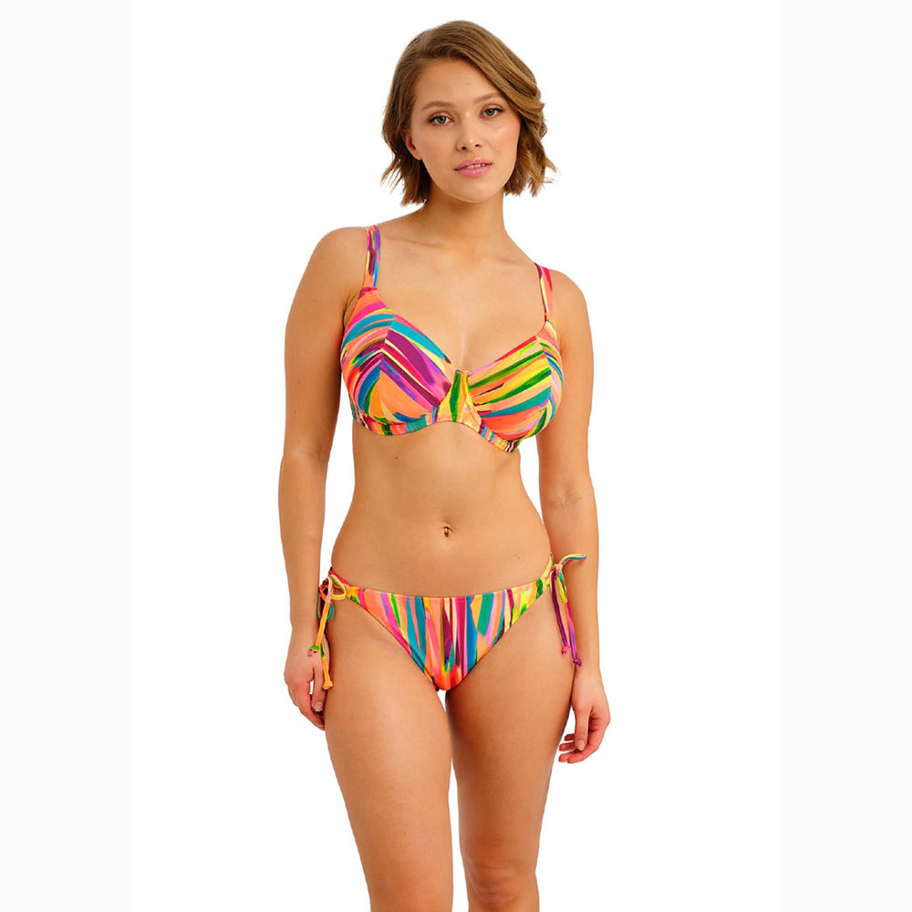 woman wearing a colourful bikini set on a white background