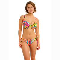 woman wearing a colourful bikini set on a white background