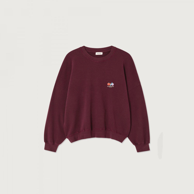 A deep burgundy crew neck sweatshirt with a logo on the right hand side, laid flat on a white background.