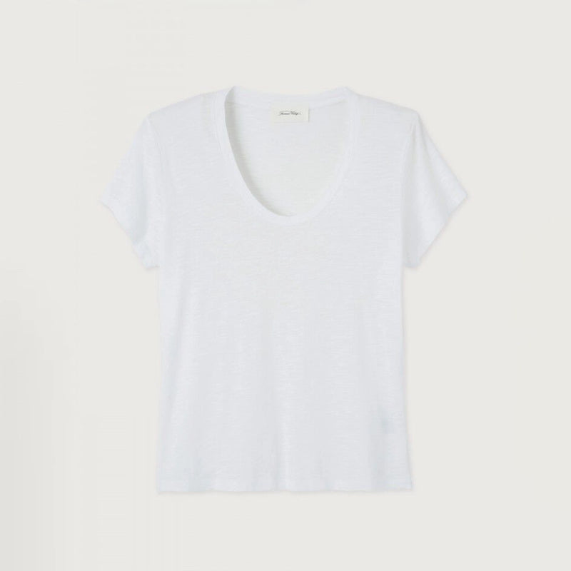 A white short-sleeve V-neck t-shirt with a relaxed, cropped fit, laid flat against a light beige background.