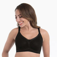woman wearing a black bralette on a white background