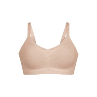 beige bralette on a white background