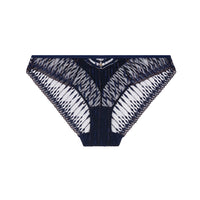 Cut out of a navy blue brief with gold-tone detail and sheer patterned mesh, photographed against a plain light beige studio background.