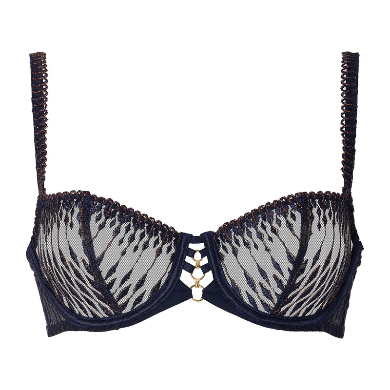 A navy blue lace bra with gold metallic trim and a central gold chain-and-rings closure, shown against a plain white background.