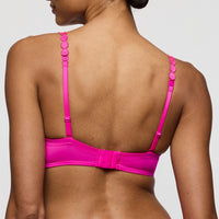 pink bra worn by a model on a plain background