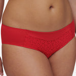 red lace-trimmed underwear on a white background