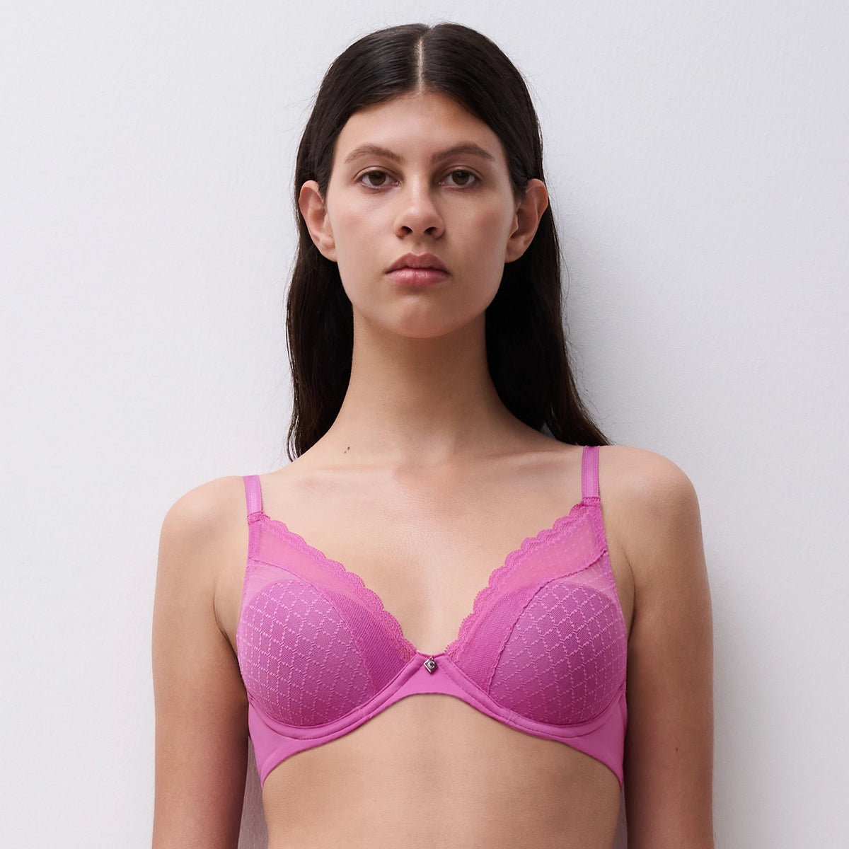  pink bra against a plain background