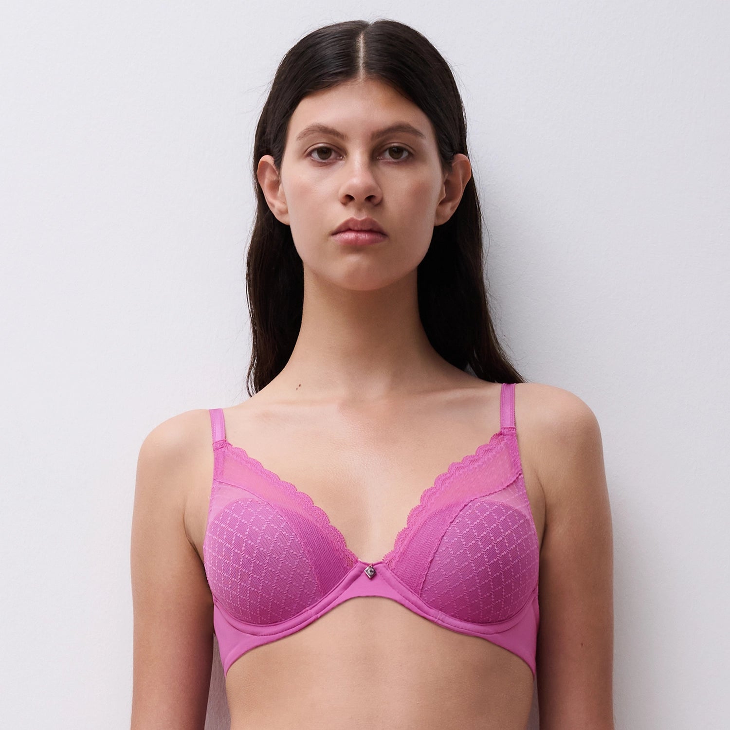  pink bra against a plain background