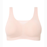 A light peach-beige wireless bra with a wide scoop neckline and wide shoulder straps, shown against a plain white background.
