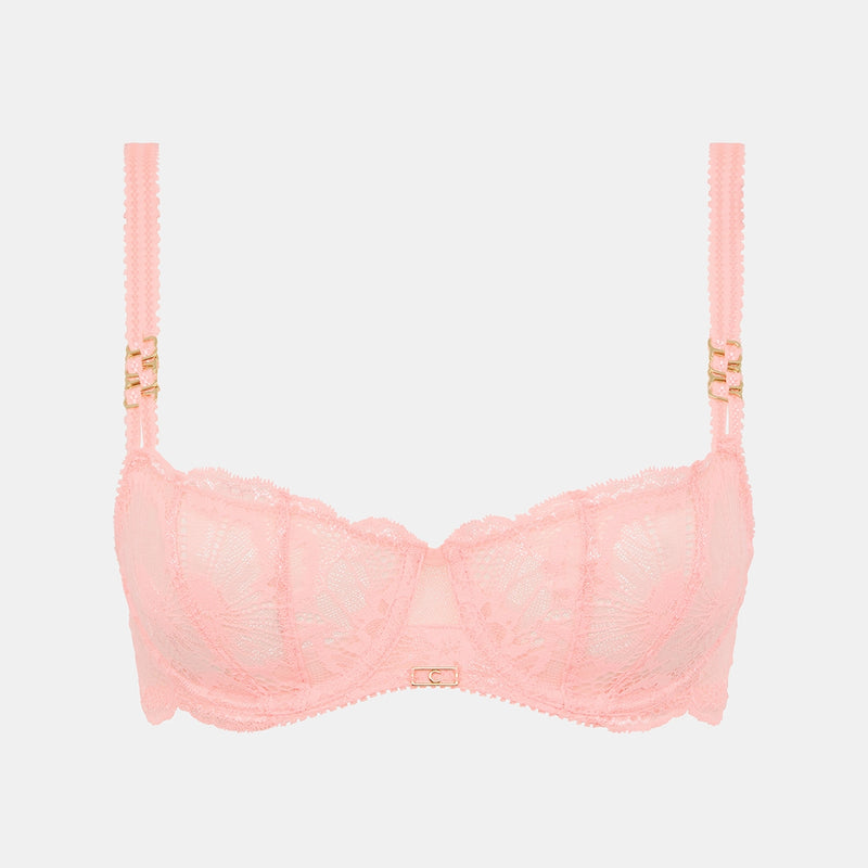 pink bra with gold straps on a light grey background