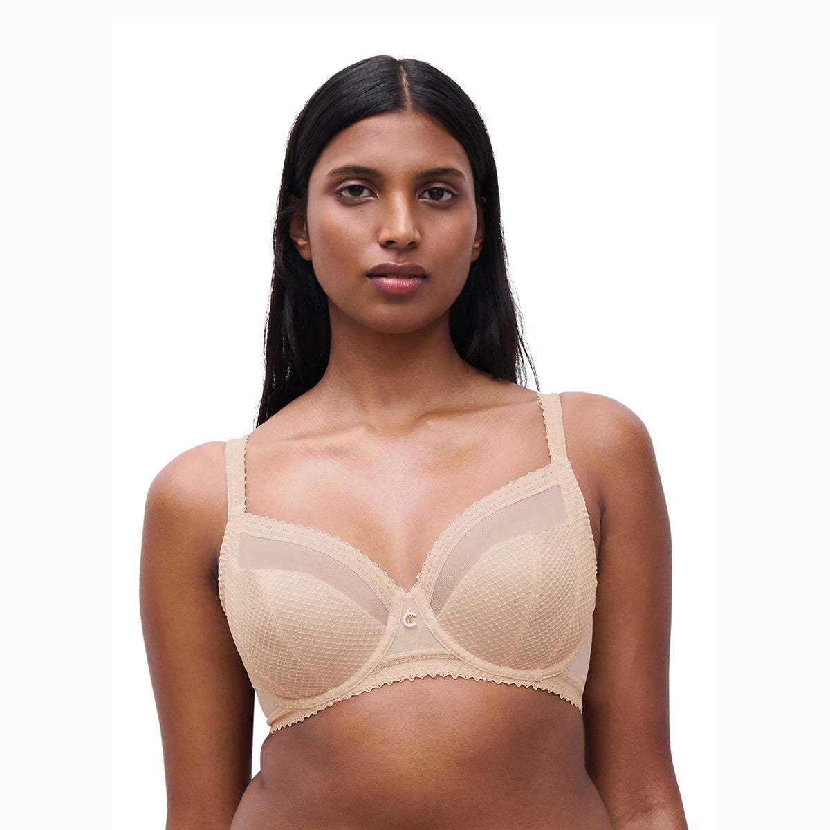 woman wearing a beige bra on a white background