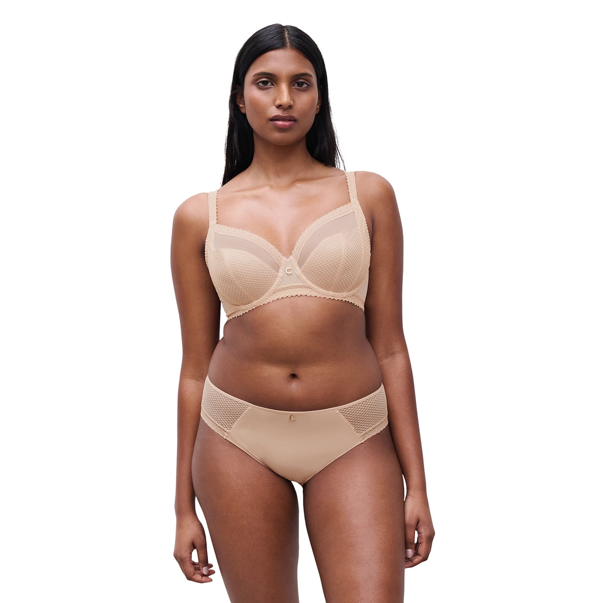 woman wearing a beige bra and panties set on a white background