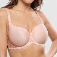pink bra worn by a person on a plain background
