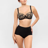black lace bra and panties set on a plain background