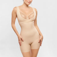 beige shapewear bodysuit worn by a model on a light grey background