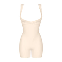 beige shapewear bodysuit on a white background