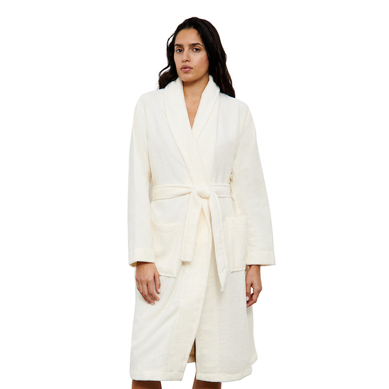 woman wearing a white robe on a white background