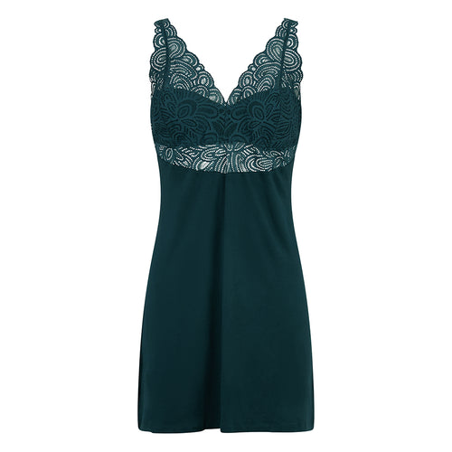 green slip dress with lace detailing on a white background