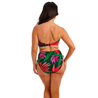 woman wearing a floral bikini set on a white background