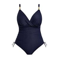 navy blue swimsuit with gold accents on a white background