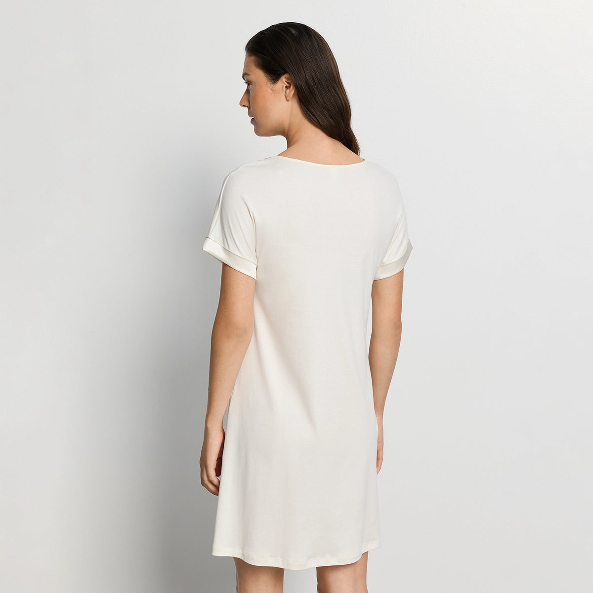 woman wearing hanro white nightdress against a plain background