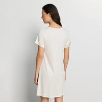 woman wearing hanro white nightdress against a plain background