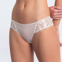white lace underwear on a plain background