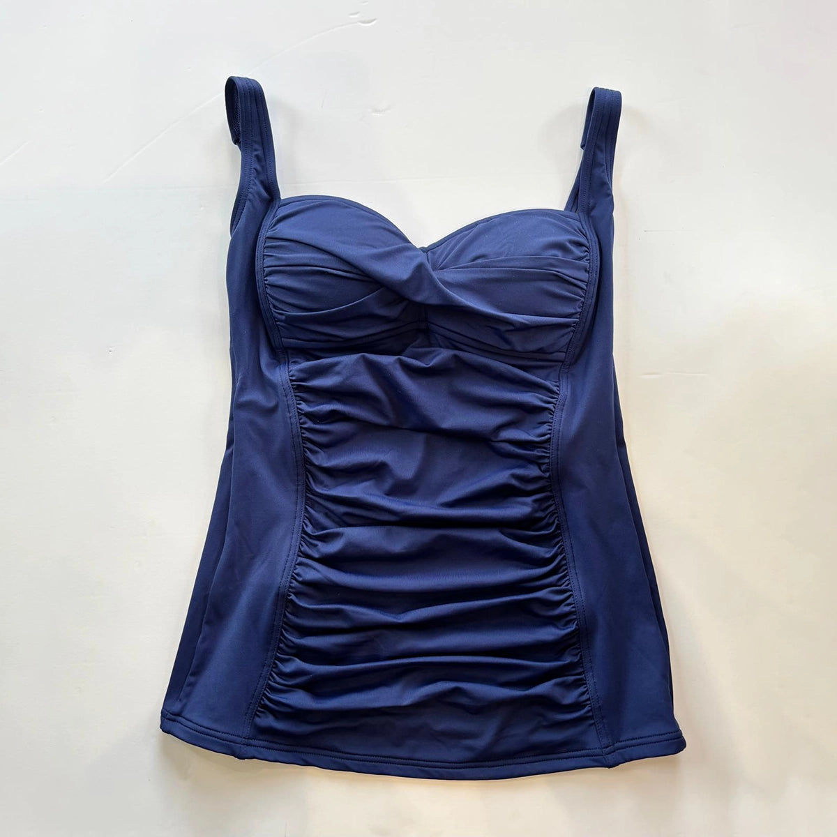 Blue tankini on a light beige background