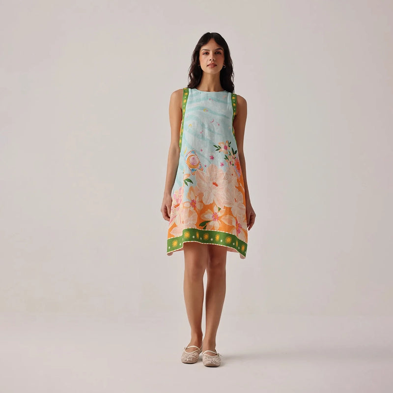 woman wearing a floral dress on a plain background