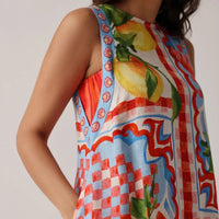 colourful sleeveless dress with lemon print on a plain background