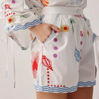 white embroidered shorts detail