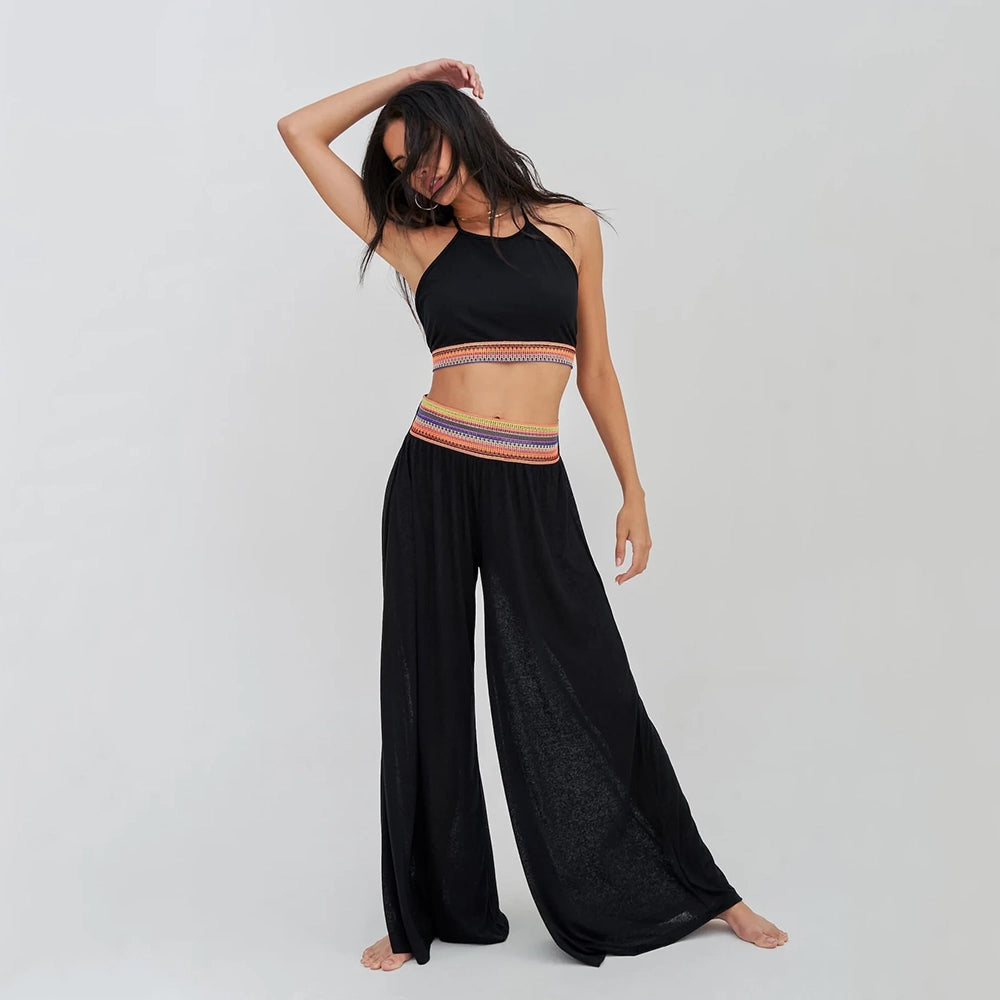 pitusa halter top and wide leg trousers on model in black