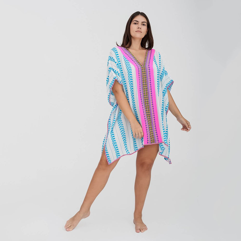 pitusa mini thobe in white with pink and blue detail on model