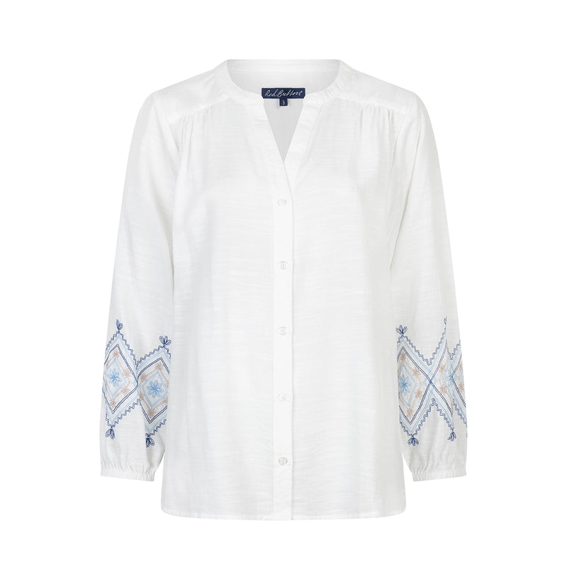 white blouse with embroidered sleeves on a white background