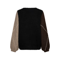 A black knit sweater shown from behind with contrasting sleeves, featuring a light beige sleeve on the left and a dark brown sleeve on the right, both detailed with diagonal white stitched lines.
