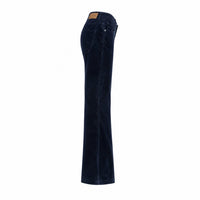 A pair of dark navy blue flare jeans shown from a side profile view against a solid white background.