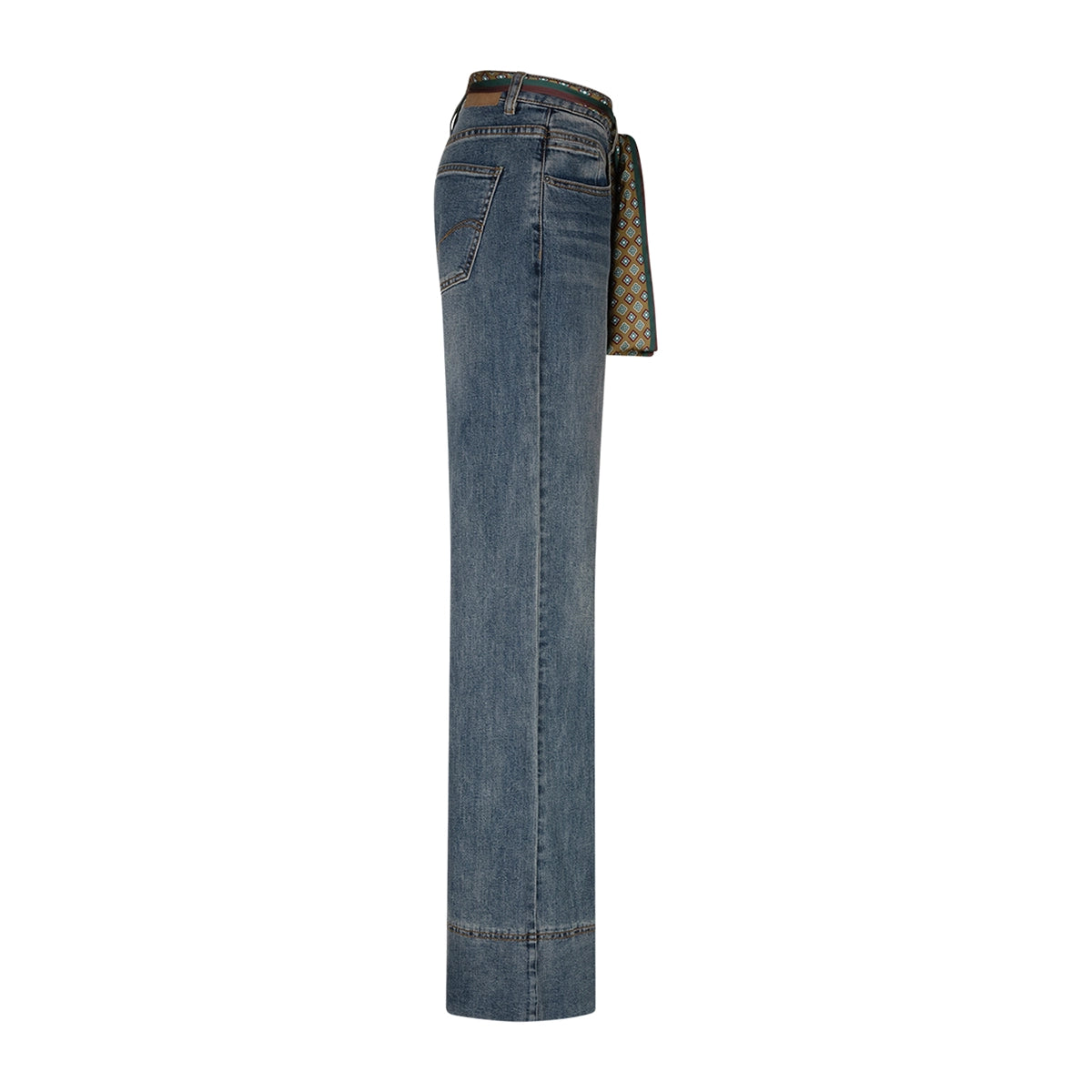 A pair of high-waisted blue denim jeans shown from the side, featuring a patterned scarf tie belt in beige, green, and black, set against a plain white background.