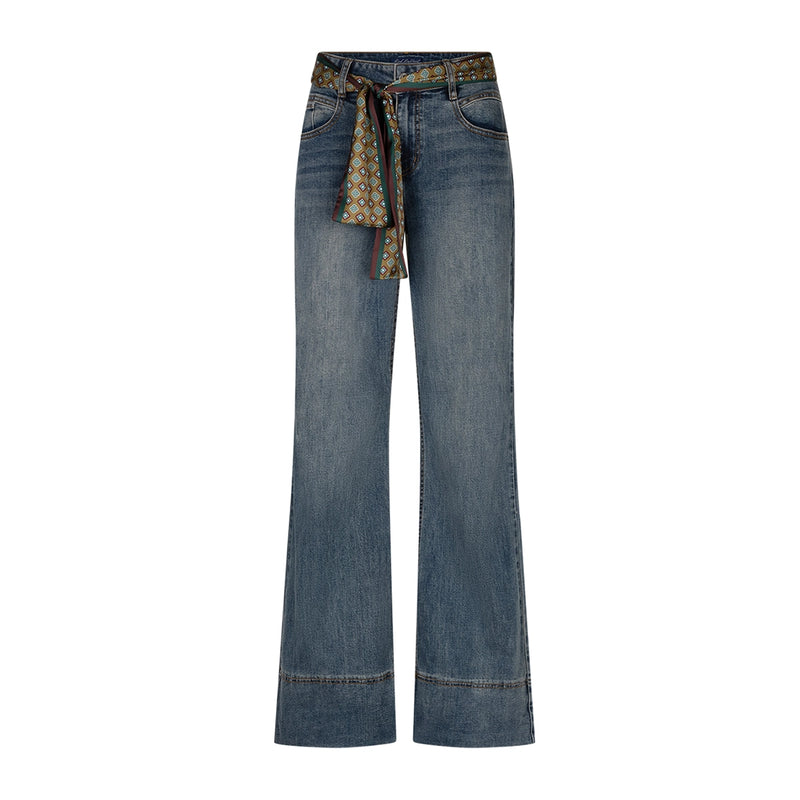A pair of wide-leg blue denim jeans with a patterned fabric tie belt at the waist, shown against a plain white background.