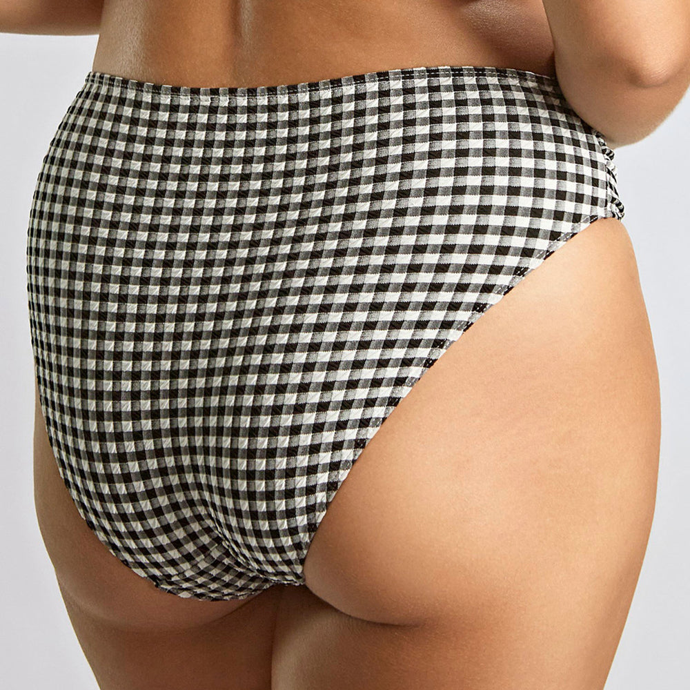 black and white high-waisted bikini bottom on a neutral background