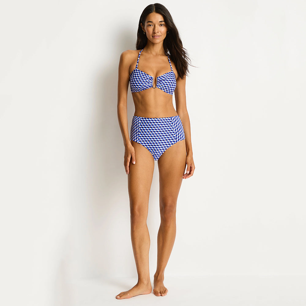 woman wearing a blue and white checkered bikini on a white background