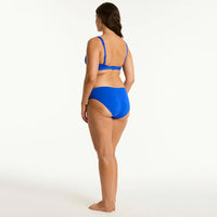 woman wearing a blue bikini on a white background
