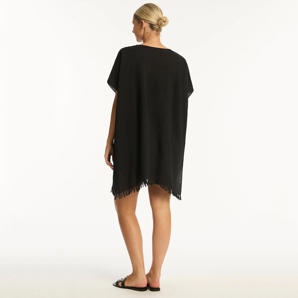 woman wearing a black dress on a white background