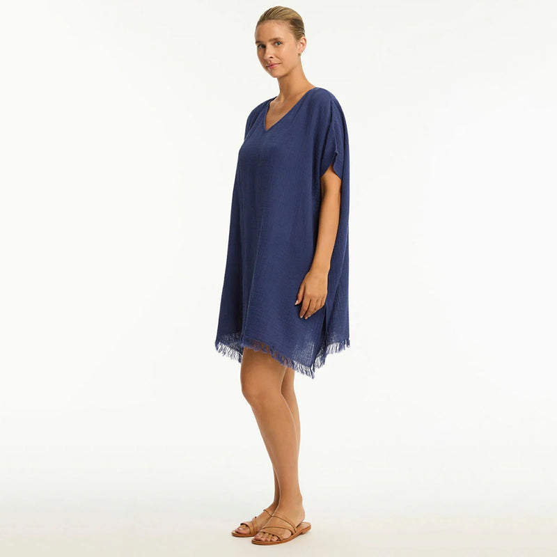 woman wearing a kaftan on a white background