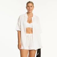 sea leave sunset aloha shirt paired with white bikini top and shorts