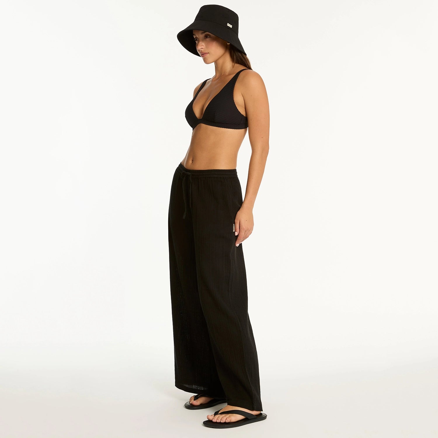 sea level sunset black beach pant on model