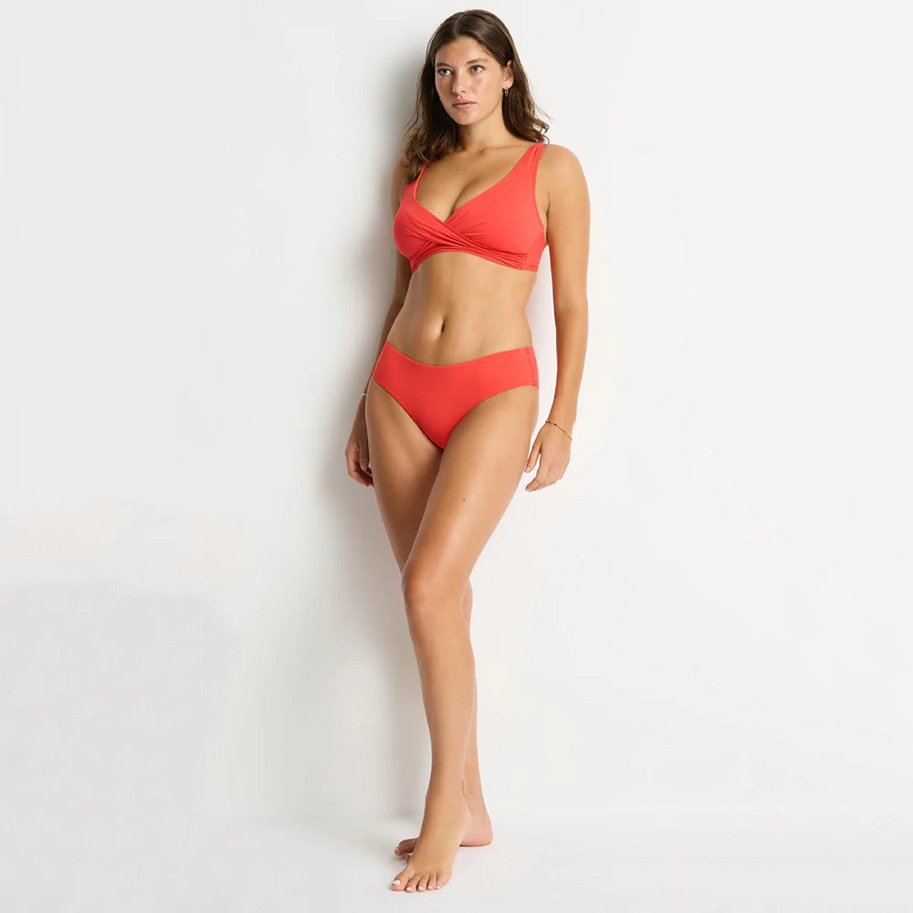 sea level cross front orange bikini top and bottom on a model
