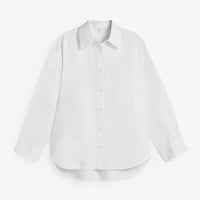 A white long-sleeve button-up shirt with a pointed collar, displayed flat against a clean white background.